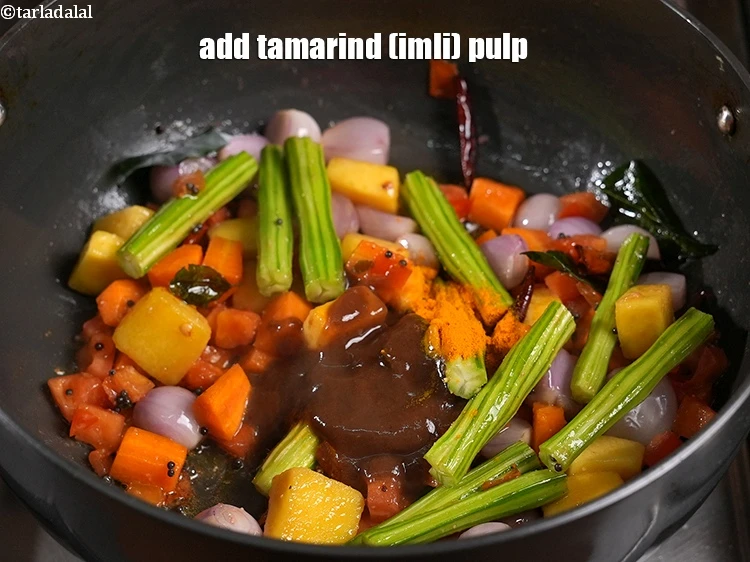 Step 37 – <p>Add the <span style="background-color:rgb(255,255,255);color:rgb(0,0,0);">2 tbsp </span><a href="https://www.tarladalal.com/glossary-tamarind-pulp-tamarind-extract-imli-ka-pulp-838i"><u>tamarind (imli) pulp</u></a>.&nbsp;</p>