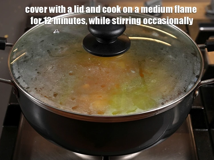 Step 40 – <p>Cover with a lid and cook on a medium flame for 12 minutes, while stirring …
