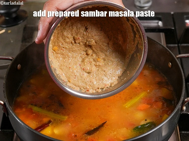 Step 43 – <p>Add the <strong>prepared sambar masala paste</strong>.</p>