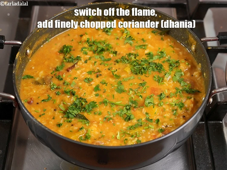 Step 49 – <p>Switch off the flame, add the <span style="background-color:rgb(255,255,255);color:rgb(0,0,0);">2 tbsp finely </span><a href="https://www.tarladalal.com/glossary-coriander-dhania-kothmir-369i#ing_2365"><u>chopped coriander (dhania)</u></a><u>.</u></p>