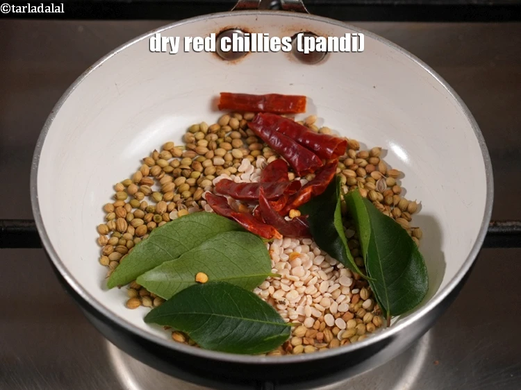 Step 7 – <p>Add the <span style="background-color:rgb(255,255,255);color:rgb(0,0,0);">4 </span><a href="https://www.tarladalal.com/glossary-pandi-chillies-pandi-dry-red-chillies-2373i"><u>pandi chillies </u></a><span style="background-color:rgb(255,255,255);color:rgb(0,0,0);">, broken into pieces</span>. We have used …