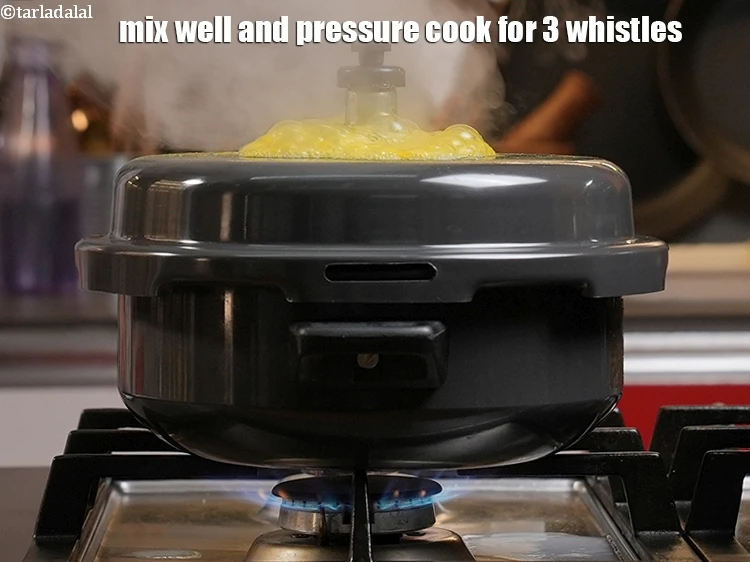 Step 12 – <p>Mix well and pressure cook for 3 whistles.</p>