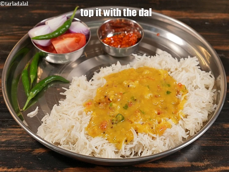 Step 33 – <p>Top it with ¼th of the dal.</p>