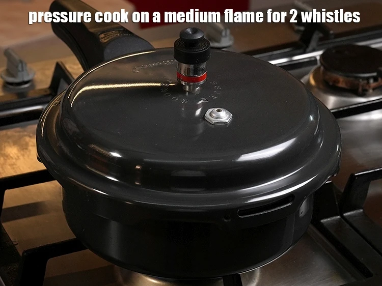Step 7 – <p>Pressure cook on a medium flame for 2 whistles.</p>
