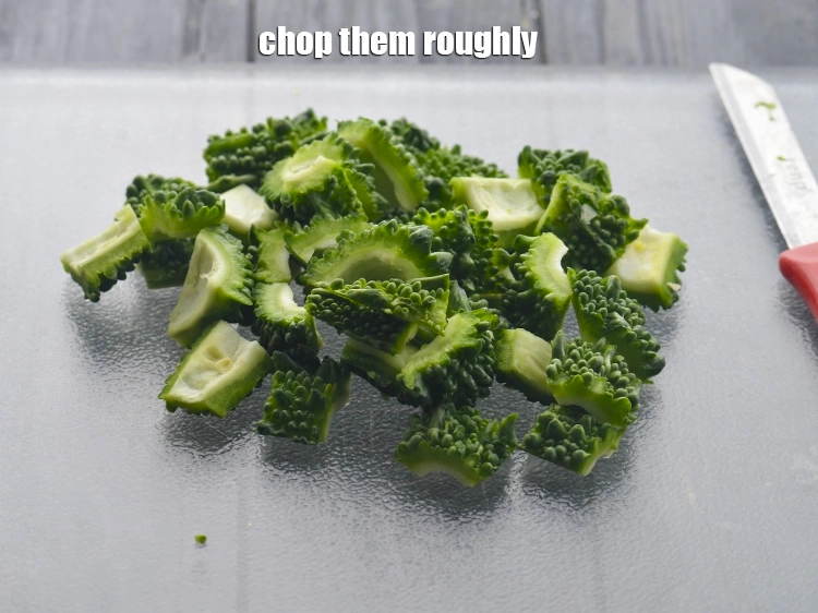 Step 7 – <p>Place the clean outer green flesh of karela flat-side down on the cutting board. Chop …