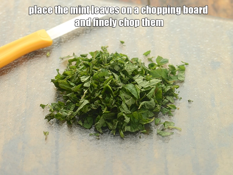 Step 19 – <p>Place the mint leaves on a chopping board and finely chop them.</p>