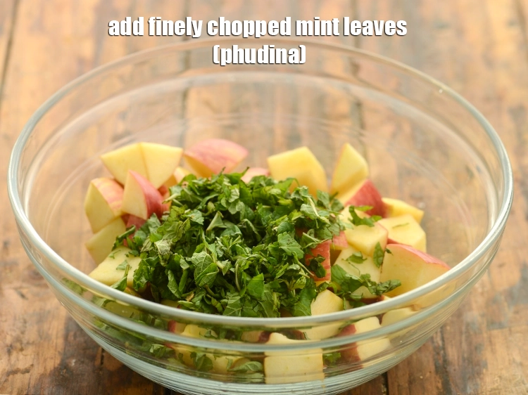Step 20 – <p>Add the <span style="background-color:rgb(255,255,255);color:rgb(0,0,0);">1/4 cup finely </span><a href="https://www.tarladalal.com/glossary-mint-leaves-pudina-phudina-521i#ing_2368"><u>chopped mint leaves (phudina)</u></a> to the apples to …