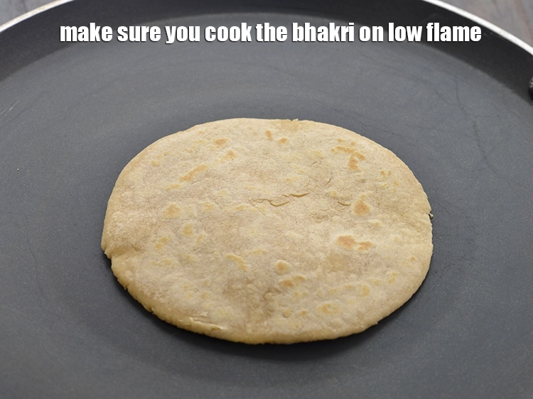 Step 19 – <p>Make sure you cook the<strong> bhakri</strong> on low flame. If you will cook it on …