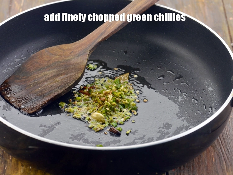 Step 15 – <p>Now, add the <span style="background-color:rgb(255,255,255);color:rgb(0,0,0);">2 tsp </span><a href="https://www.tarladalal.com/glossary-green-chillies-hari-mirch-331i#ing_3504"><u>finely chopped green chillies</u></a> for a spicy taste.</p>
