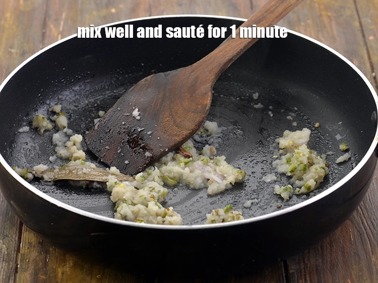 Step 17 – <p>Mix well and <strong>sauté</strong> for 1 minute till the onion paste has slightly turned golden.</p>