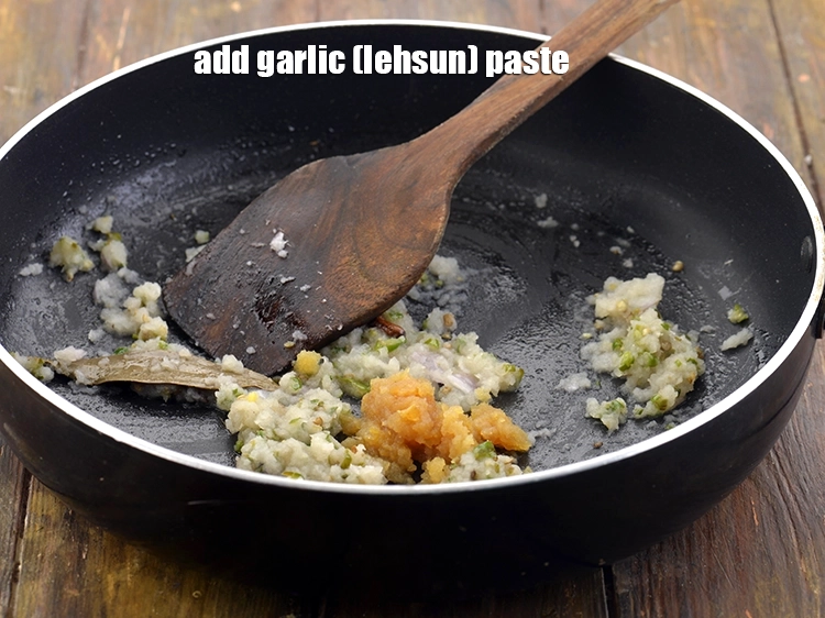 Step 18 – <p>Now, add the <span style="background-color:rgb(255,255,255);color:rgb(0,0,0);">2 tsp </span><a href="https://www.tarladalal.com/glossary-garlic-lehsun-lahsun-348i#ing_2752"><u>garlic (lehsun) paste</u></a>. This paste can be made …