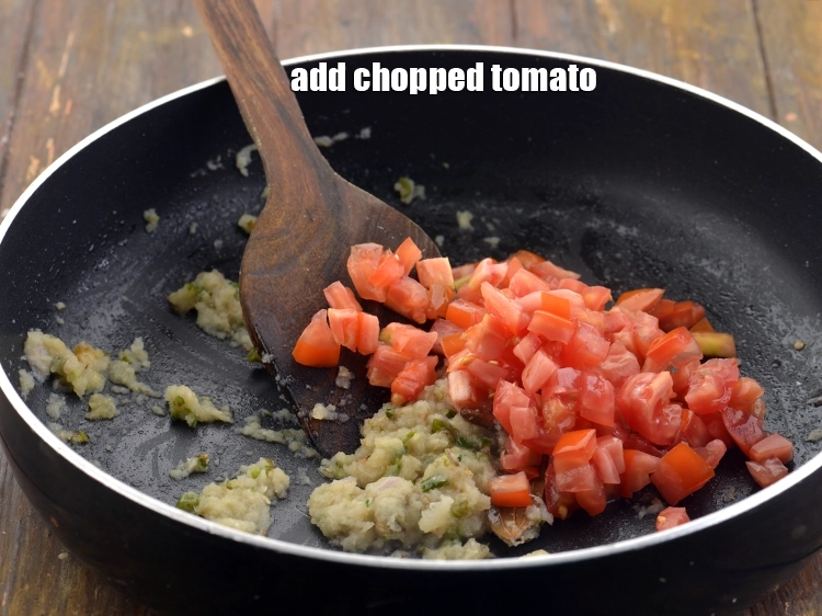 Step 20 – <p>Now, add the <span style="background-color:rgb(255,255,255);color:rgb(0,0,0);">1/2 cup </span><a href="https://www.tarladalal.com/glossary-tomatoes-tamatar-639i#ing_2361"><u>chopped tomato</u></a>. The tomatoes are not finely chopped …