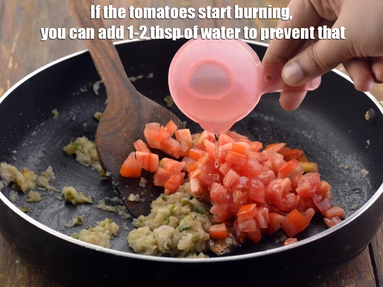 Step 21 – <p>If the tomatoes start burning, you can add 1-2 tbsp. of <strong>water</strong> to prevent that.</p>