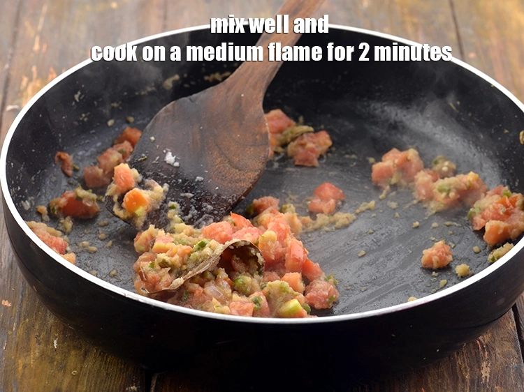 Step 22 – <p>Mix well and cook on a medium flame for 2 minutes, while stirring continuously.</p>