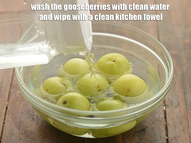 Step 7 – <html><head><meta charset="UTF-8"></head><body><p><strong>Wash</strong> the gooseberries with clean water and <strong>wipe</strong> with a clean kitchen towel.&nbsp;</p></body></html>