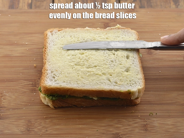 Step 12 – <p>Spread about ½ tsp <a href="https://www.tarladalal.com/glossary-butter-makhan-233i"><u>butter</u></a> evenly on the bread slices.</p>
