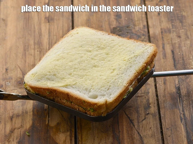 Step 14 – <p>Place the <strong>sandwich</strong> in the sandwich toaster.</p>