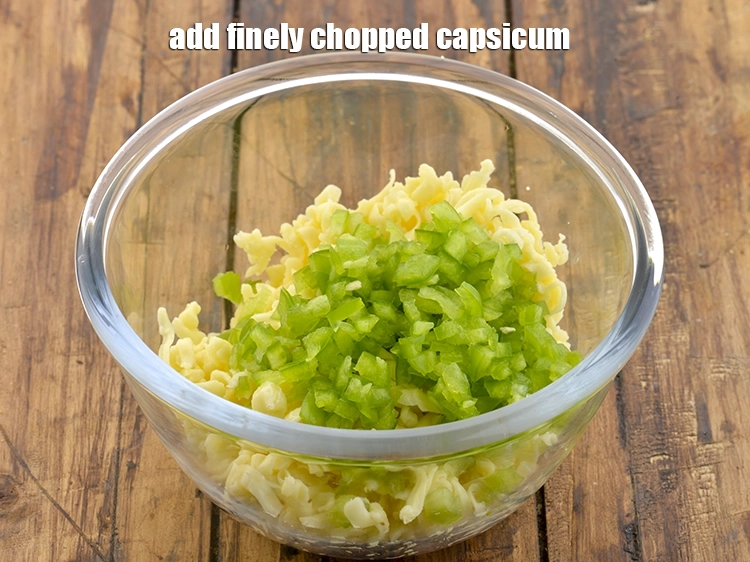 Step 2 – <p>Add the <span style="background-color:rgb(255,255,255);color:rgb(0,0,0);">1/4 cup finely </span><a href="https://www.tarladalal.com/glossary-capsicum-shimla-mirch-bell-pepper-163i#ing_2311"><u>chopped capsicum</u></a>.</p>