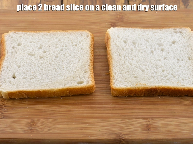 Step 6 – <p>Place 2 <a href="https://www.tarladalal.com/glossary-bread-219i"><u>bread</u></a> slice on a clean and dry surface.</p>