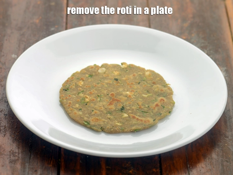 Step 14 – <p>Remove the <strong>multigrain garlic roti</strong> in a plate.</p>