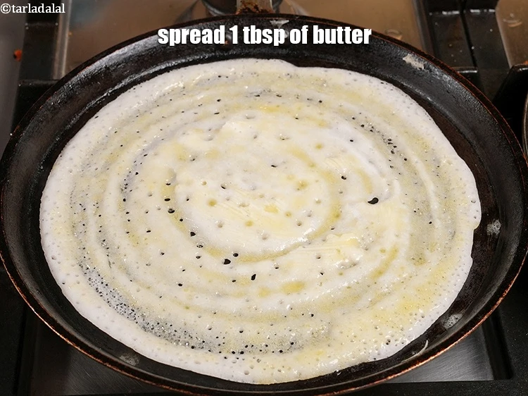 Step 19 – <p><span style="color:rgb(0,0,0);">Spread 1 tbsp. of </span><a href="https://www.tarladalal.com/glossary-butter-makhan-233i"><u>butter</u></a><span style="color:rgb(0,0,0);">.</span></p>