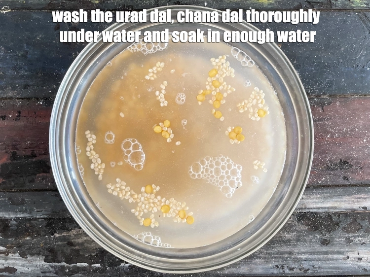 Step 8 – <p><strong>Wash</strong> the <strong>urad dal, chana dal</strong> thoroughly under water and soak in enough water.</p>