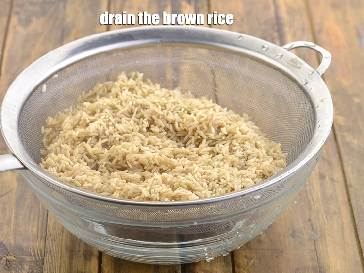 Step 10 – <p>Drain the <strong>brown rice</strong> using a strainer.</p>