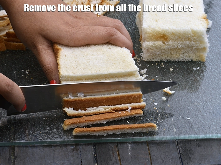 Step 2 – <p><span style="background-color:rgb(255,255,255);color:rgb(0,0,0);">Remove the crust from all the <strong>bread slices.</strong></span></p>