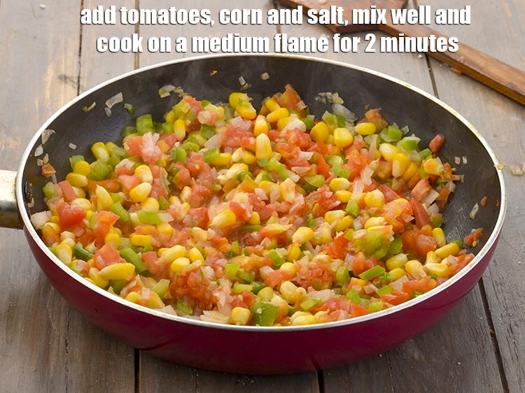 Step 9 – <p><span style="background-color:rgb(255,255,255);color:rgb(0,0,0);">Add the 1 cup </span><a href="https://www.tarladalal.com/glossary-tomatoes-tamatar-639i#ing_2361"><u>chopped tomato</u></a><span style="background-color:rgb(255,255,255);color:rgb(0,0,0);">, 3/4 cup </span><a href="https://www.tarladalal.com/glossary-sweet-corn-kernels-makai-ke-dane-156i#ing_2309"><u>boiled sweet corn …