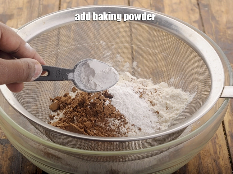 Step 10 – <p>Add <span style="background-color:rgb(255,255,255);color:rgb(0,0,0);">1 1/2 tsp </span><a href="https://www.tarladalal.com/glossary-baking-powder-425i"><u>baking powder</u></a>.</p>