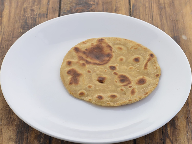 Step 43 – <p><span style="background-color:rgb(255,255,255);color:rgb(0,0,0);">Remove the </span><strong>tawa paratha</strong><span style="background-color:rgb(255,255,255);color:rgb(0,0,0);"> in a plate.</span></p>