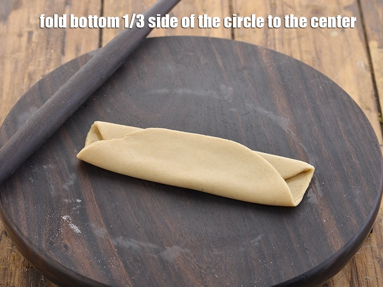 Step 28 – <p>Fold bottom 1/3 side of the circle to the center.</p>