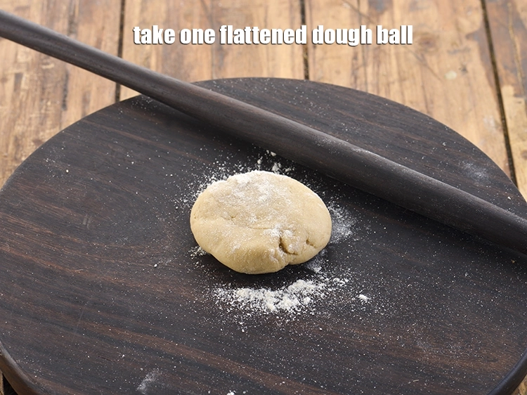 Step 23 – <p>For making <strong>square folded paratha,</strong> take one flattened dough ball.</p>