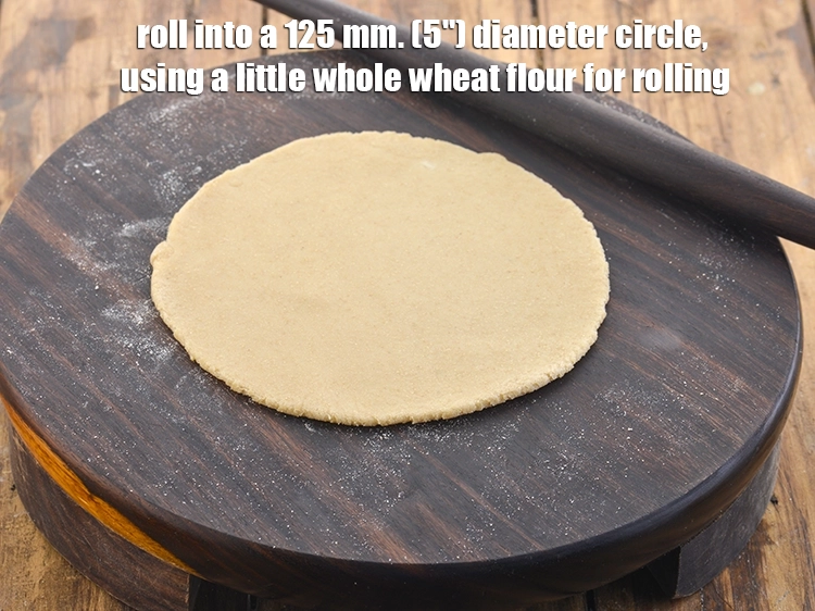 Step 24 – <p>Roll into a 125 mm. (5") diameter circle, using a little whole wheat flour for …