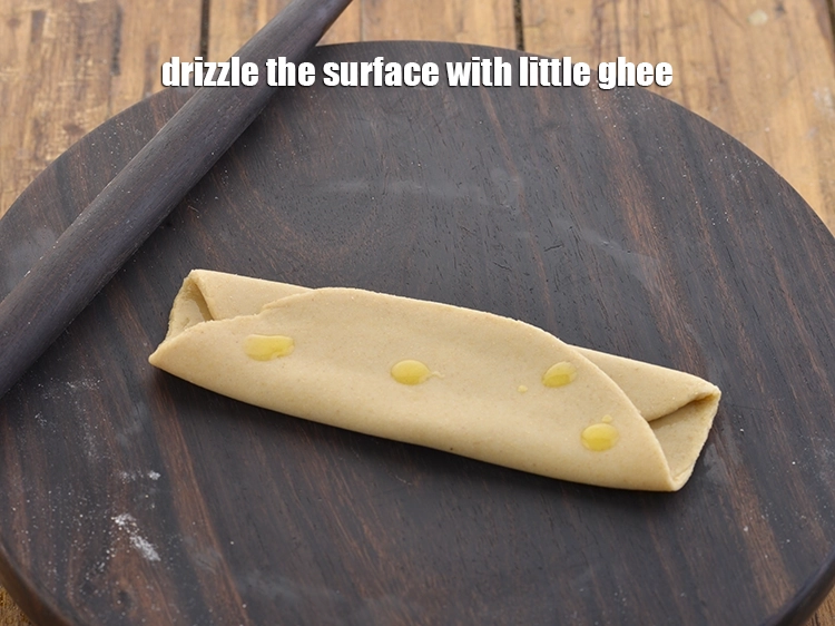 Step 29 – <p>Drizzle the surface with little <a href="https://www.tarladalal.com/glossary-ghee-245i"><u>ghee</u></a>.</p>