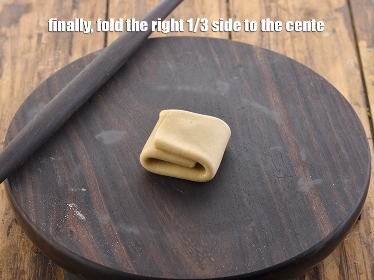 Step 32 – <p>Finally, fold the <strong>right</strong> 1/3 side to the center. This will form a square shaped …