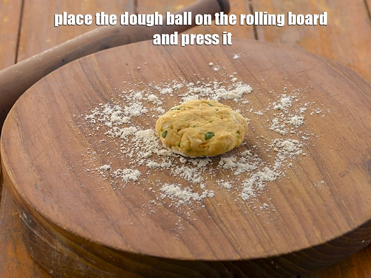 Step 20 – <p>Place the dough ball on the rolling board and press it.</p>