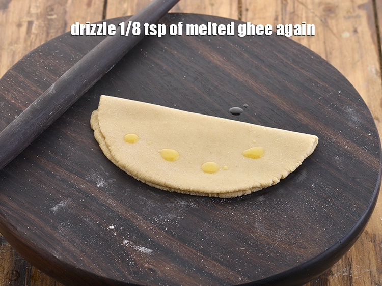 Step 15 – <p>Drizzle 1/8 tsp of melted <a href="https://www.tarladalal.com/glossary-ghee-245i"><u>ghee</u></a> again.</p>