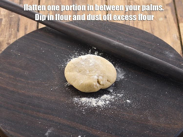 Step 10 – <p>Flatten one portion in between your palms. Dip in flour and dust off excess flour. …