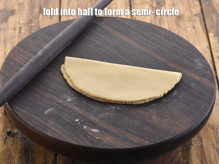 Step 14 – <p>Fold into half to form a semi- circle.</p>