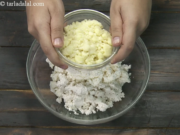 Step 8 – <p>Add 1/2 cup&nbsp;<a href="https://www.tarladalal.com/glossary-crumbled-mawa-2259i">crumbled mava (khoya)</a>.</p>