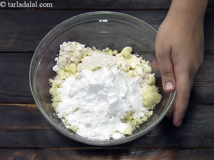 Step 9 – <p>Add 5 tbsp&nbsp;<a href="https://www.tarladalal.com/glossary-powdered-sugar-280i">powdered sugar</a>.</p>