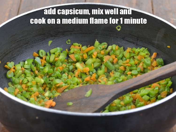 Step 4 – <p><span style="background-color:rgb(255,255,255);color:rgb(0,0,0);">Add the 5 tbsp finely </span><a href="https://www.tarladalal.com/glossary-capsicum-shimla-mirch-bell-pepper-163i#ing_2311"><u>chopped capsicum</u></a><span style="background-color:rgb(255,255,255);color:rgb(0,0,0);">, mix well and cook on …