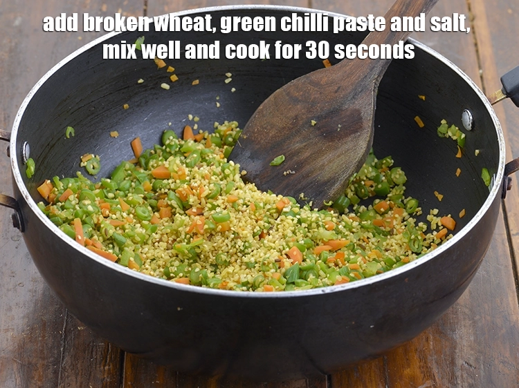 Step 5 – <p><span style="background-color:rgb(255,255,255);color:rgb(0,0,0);">Add the <strong>broken wheat</strong>, 1/2 tsp </span><a href="https://www.tarladalal.com/glossary-green-chilli-paste-hari-mirch-ki-paste-mirchi-paste-333i"><u>green chilli paste</u></a><span style="background-color:rgb(255,255,255);color:rgb(0,0,0);"> and 1/8 tsp …