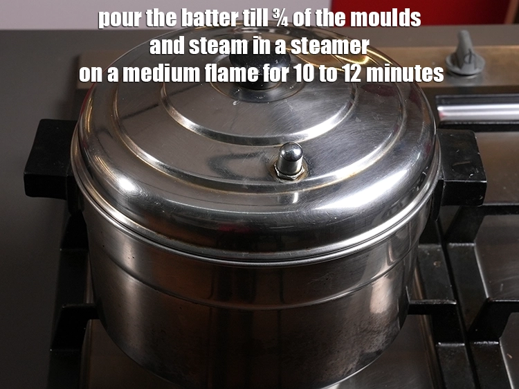 Step 10 – <p><span style="background-color:rgb(255,255,255);color:rgb(0,0,0);">Place 7 greased <strong>sanna moulds</strong> or small steel vati and pour the batter till …