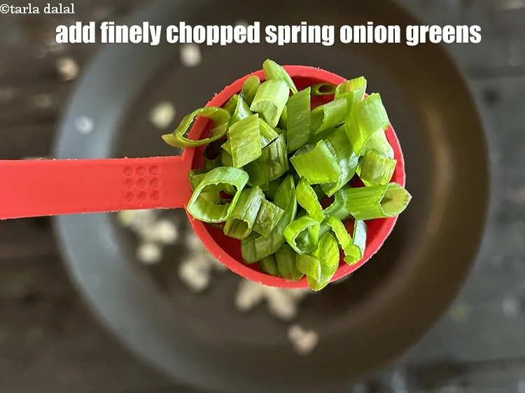 Step 9 – <html><head></head><body><p>Add&nbsp;2 tbsp&nbsp;finely&nbsp;<a href="glossary-chopped-spring-onion-greens-1030i">chopped spring onion greens</a>.</p></body></html>