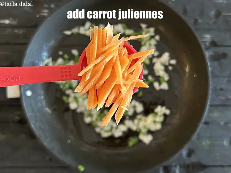 Step 11 – <html><head></head><body><p>Add&nbsp;<span style="background-color:rgb(255,255,255);color:rgb(0,0,0);">3 tbsp finely </span><a href="https://www.tarladalal.com/glossary-carrot-gajar-gajjar-253i#ing_2376"><u>chopped carrot</u></a> juliennes.</p></body></html>
