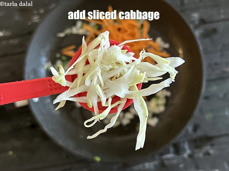 Step 12 – <html><head></head><body><p>Add&nbsp;2 tbsp sliced&nbsp;<a href="https://www.tarladalal.com/glossary-cabbage-patta-gobi-kobi-248i#ing_2354"><u>cabbage</u></a>.</p></body></html>