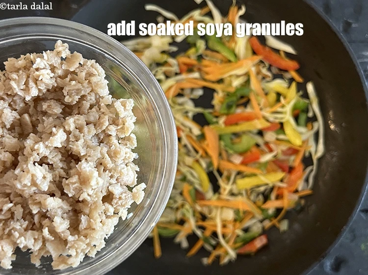 Step 15 – <p>Add the <strong>soaked soya granules</strong>.</p>
