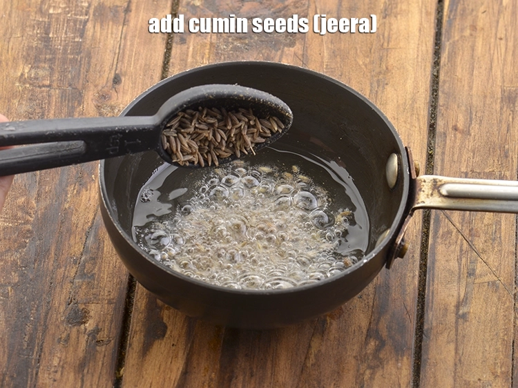 Step 11 – <p>Now add the <span style="background-color:rgb(255,255,255);color:rgb(0,0,0);">1 tsp </span><a href="https://www.tarladalal.com/glossary-cumin-seeds-jeera-zeera-381i"><u>cumin seeds (jeera)</u></a>.</p>
